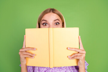 Poster - Photo of lovely adorable cute girl wear trendy purple clothes hold book isolated on green color background