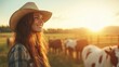 © familymedia - Happy woman wearing a straw hat smiles in a sunlit farm field with cows grazing in the background, epitomizing pastoral joy, contentment, and rustic life charm.
