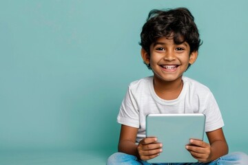 Canvas Print - Indian kid reading the tablet happy electronics surprised.