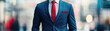 © Marcel - A well-dressed man in a striking blue suit with a red tie stands confidently, epitomizing professionalism and modern style amidst an urban backdrop.
