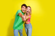 © deagreez - Photo of two nice young people dance empty space ad wear t-shirt isolated on bright yellow color background
