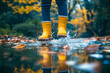 © ZaStock - A young girl delights in jumping through puddles wearing cheerful yellow rain boots, surrounded by colorful autumn leaves in a serene park setting