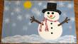 © Natalia - Child's handmade winter snowman craft with colorful details on light blue background, festive creativity, copy space