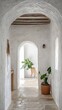© Simone - Rustic Boho Farmhouse Hallway with White Stucco Walls and Arched Doorway