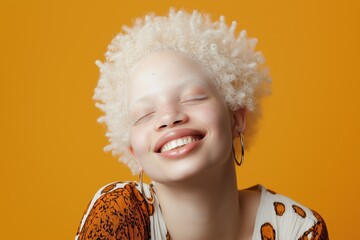 Sticker - A woman with blonde hair and gold hoop earrings is smiling and posing for a picture. The image has a bright and cheerful mood, with the woman's smile and the orange and yellow colors of her outfit