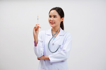 Female doctor in medical gown holding syringe on white background.