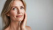 © Omid - smooth-skinned woman in her 50s, isolated beauty portrait, rejuvenation and facial treatment