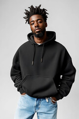 Wall Mural - black african american male model wearing a black heavyweight cotton blank oversize hoodie, baggy blue jeans, clothing mockup