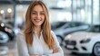 © Attasit - Smiling saleswoman presenting car options in a showroom