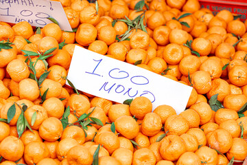 Fresh tangerines with leaves forming a texture at the market in Dierona village, Cyprus