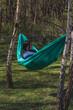© mykhailo - A woman relaxes in a hammock in the garden Lviv Ukraine 07.04.2024
