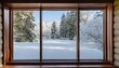 © Bonita - A residential window framed by a serene landscape of snow-covered surroundings and towering trees. The windowpane captures the tranquility of a winter scene, where the pristine white snow blankets