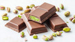 © Robert Kneschke - Close-up of decadent Dubai chocolate bars filled with vibrant pistachio mixture, showcasing their rich texture and luxurious appeal, surrounded by scattered whole pistachios on a light surface.