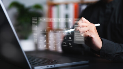 Time management concept. Calendar on a virtual screen. Business people manage time for effective work. Make an appointment, action plans, highlight reminders, and meeting agenda on the calendar.