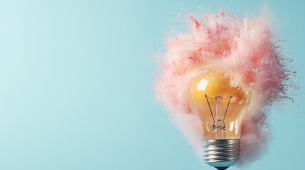 A light bulb explodes with a vibrant burst of colored powder, photographed against a pale blue backdrop, symbolizing innovative ideas and creativity in concept art.