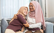 © Art_Photo - Muslim mother and daughter with hijab sitting together hugging showing love and affection, family, islamic family relationship, emotional connection happy moment, elderly care, intergenerational love