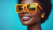 © SerPak - A woman showcases her radiant smile while donning stylish yellow sunglasses. The vibrant blue backdrop enhances her joyful expression, creating a playful and energetic atmosphere perfect for summer vi