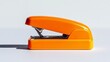 © arhendrix - Bright orange stapler on a white background. Perfect for office, school supplies, and stationery themes in modern design.