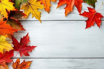 Wall Mural - Maple leaves on a white wooden background