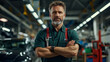 © VERTEX SPACE - confident mechanic stands with arms crossed in well equipped auto repair shop, showcasing expertise and professionalism. environment is filled with tools and vehicles, emphasizing hands on approach