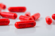 © ibragimova - Capsules in white and red on white. capsule health pill concept. close up of a capsule of medicine on a gray. close up of a capsules of medicine lifestyle on a white.