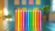 © Meawlee - Bright crayons arranged in rainbow order on a table, creative play.