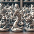 © Youttakone - A collection of intricate dragon figurines, showcasing various designs and details, arranged artistically against a blurred background of similar sculptures.