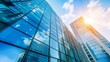 © Adi - Downtown corporate business district architecture. Glass reflective office buildings against blue sky and sun light. Economy, finances, business activity concept