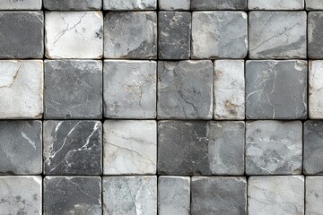 Closeup of a gray stone tile wall texture with a geometric pattern and natural marble or granite surface