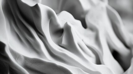  Two black and white photos depicting a cloth each, draped over the backs of chairs