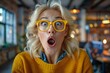 © Yuliia - Photo of Middle-aged Caucasian Woman Reacting with Surprise and Excitement to a Prediction in an Office Setting