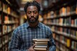 © Nataliia_Trushchenko - Young man is holding a stack of books in a library. Young man, checked shirt, holding stack of books, standing in grand library, surrounded by tall shelves, scholarly atmosphere concept