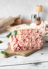 Raw minced meat , ingredients for cooking. on wooden background.