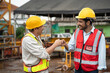 © chachamp - Asia engineer man worker hand bumping with India engineer man with crane spare part background