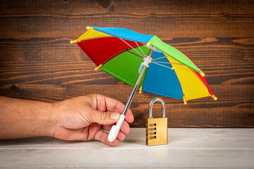 Wall Mural - Internet and data security concept. Padlock on wooden table