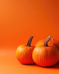 Poster - Decorative pumpkins on orange background with copy space for autumn harvest and fall decoration