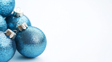 Wall Mural - Blue Christmas balls on a white background with space for text.