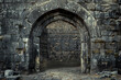 © Babb - A stone archway with a large iron gate