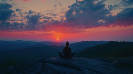 Sticker - Silhouetted Figure Meditating on a Mountaintop at Sunset