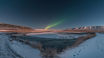 Canvas Print - Northern Lights Over a Frozen River and Snowy Landscape