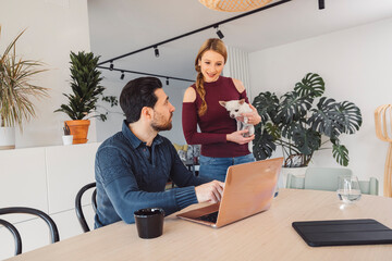 Wall Mural - The couple go about their daily chores in the apartment. The couple talks in the kitchen, sits on the sofa, at the dining table.