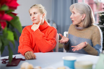 Home quarrel between mom and daughter during christmas