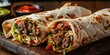© Y_Malashkevych - Shawarma wraps with grilled meat, fresh vegetables, savory sauce on wooden board, delicious street food, Turkish cuisine concept