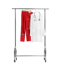 Wall Mural - Paramedic uniform and doctor's coat with stethoscope on clothing rack against white background