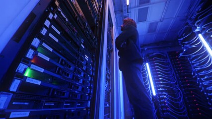 Man analysing servers in a data center
