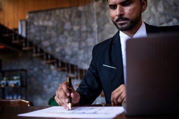 Businessman is engaged in a work discussion negotiation by document laptop checking emails and document planning on the monitor connection actively organizing  business concept