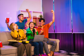 Four Asian friends, two men and two women, celebrate in an office party. They enjoy a fun-filled night with food, drinks, and laughter, bonding over teamwork and friendship.