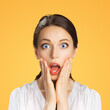 © vgstudio - Wow! Excited surprised, astonished very happy woman. Girl with wide open eyes, mouth raise hands. Unbelievable big sale, rebates offer, discounts studio image. Isolate orange yellow background. Square