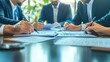 © Jang - Corporate partners signing contracts at a formal meeting in a boardroom