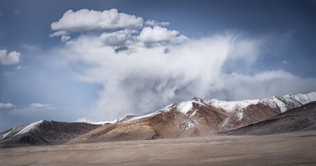 Wall Mural - Panoramic landscape of textured Tien Shan mountains in Pamir in Tajikistan, panoramic landscape of a mountain range with snow and glaciers in summer